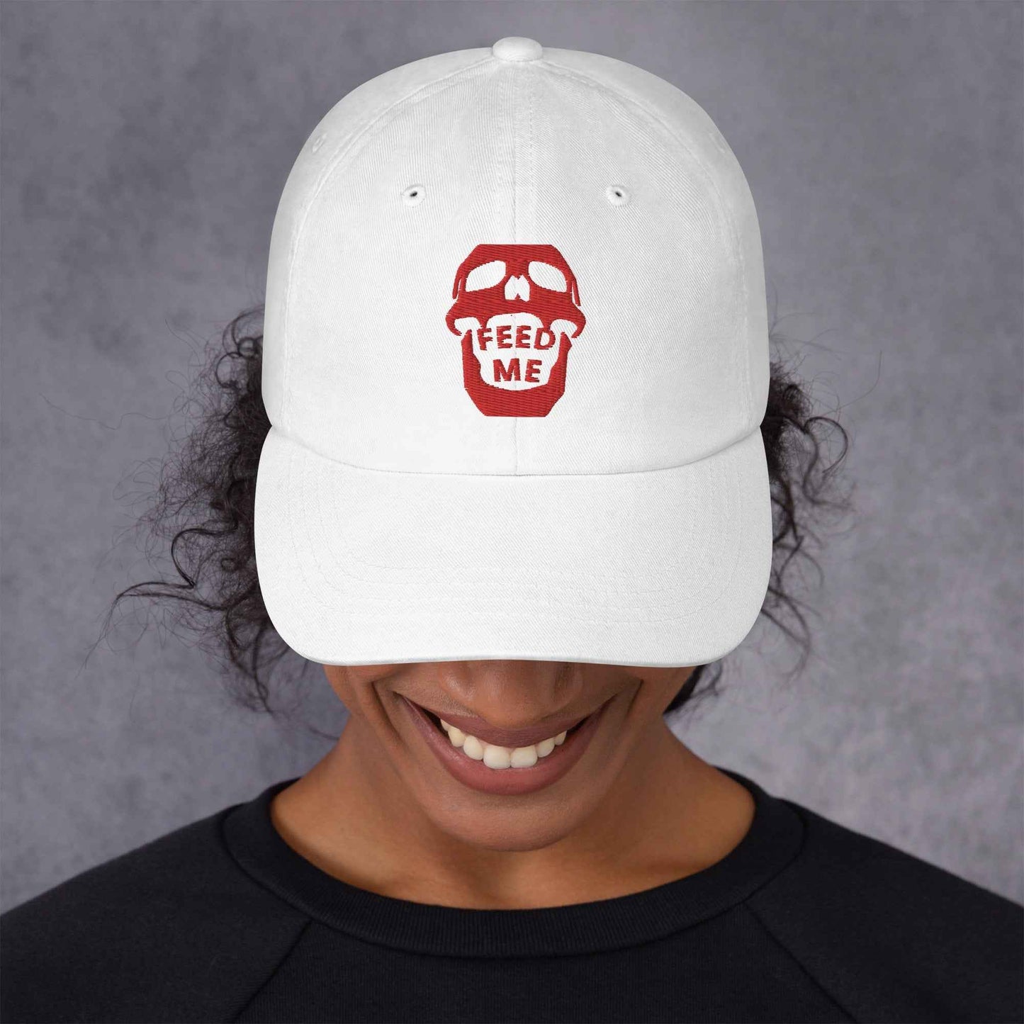 Appetite Apparel Feed Me Skull Dad Hat with playful skull graphic, casual baseball cap style, perfect for edgy streetwear looks.