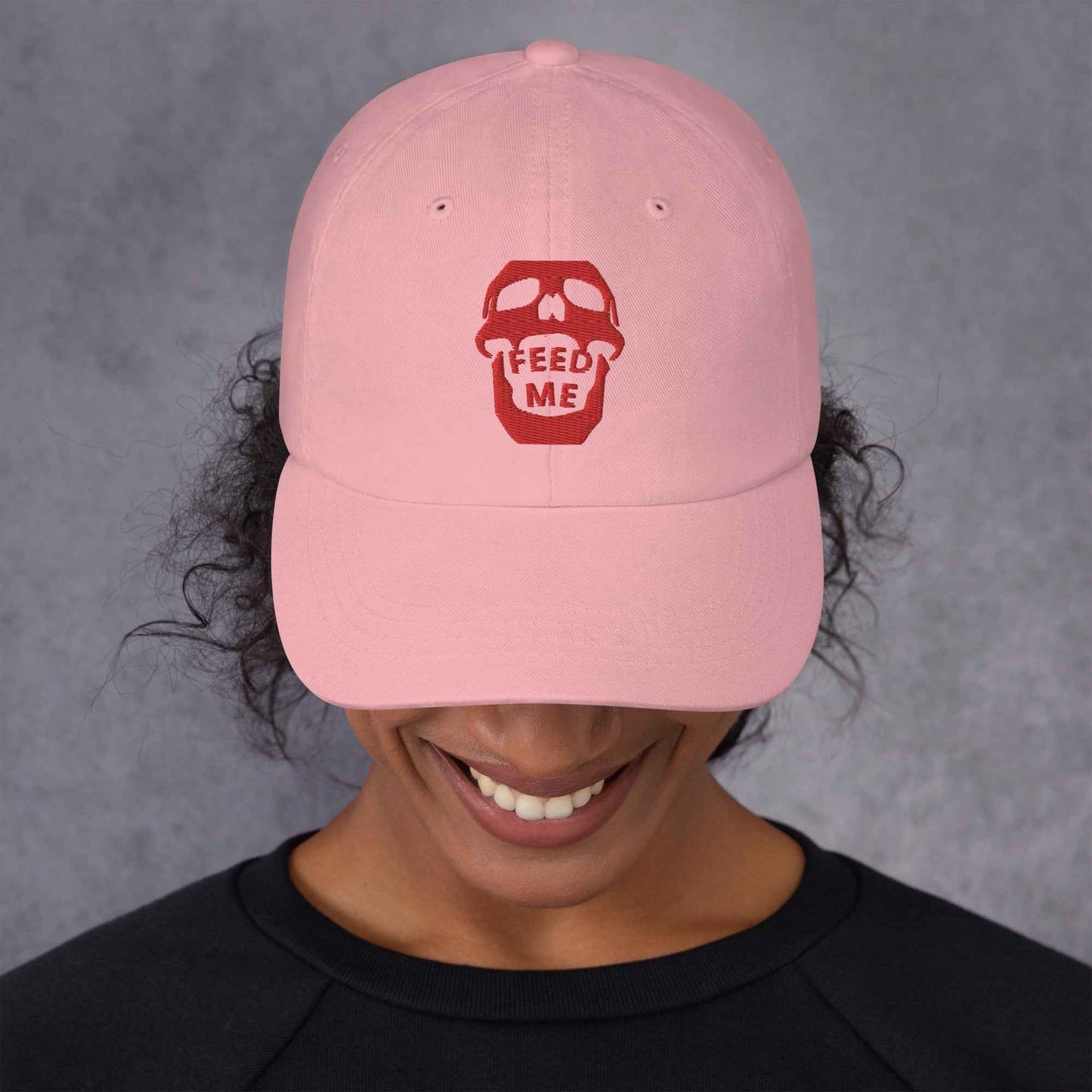 Appetite Apparel Feed Me Skull Dad Hat with playful skull and food-themed design, casual accessory for everyday wear.