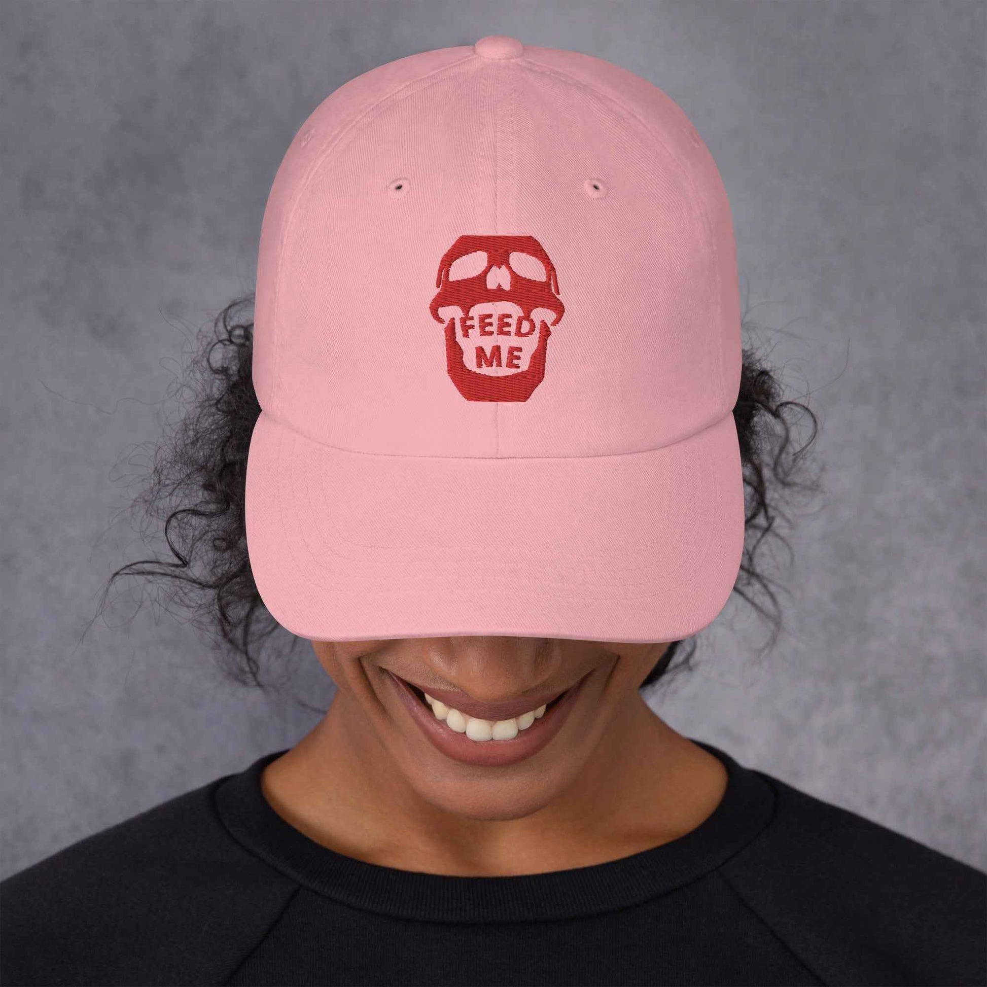 Appetite Apparel Feed Me Skull Dad Hat with playful skull and food-themed design, casual accessory for everyday wear.