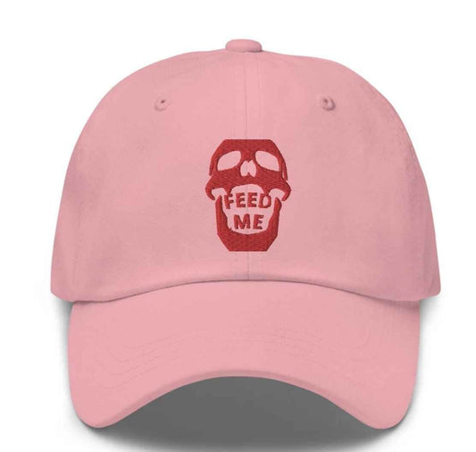 Appetite Apparel Feed Me Skull Dad Hat featuring a playful skull graphic on a casual, adjustable baseball cap.