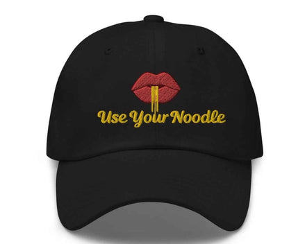 Dark grey Use Your Noodle Dad Hat by Appetite Apparel featuring a Noggin or Knob combo design.