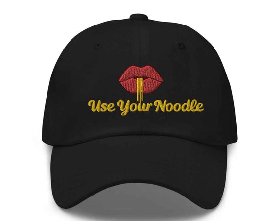 Dark grey Use Your Noodle Dad Hat by Appetite Apparel featuring a Noggin or Knob combo design.