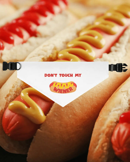 Pet dog wearing a black bandana collar with "Don't Touch My Weiner" print by Appetite Apparel.