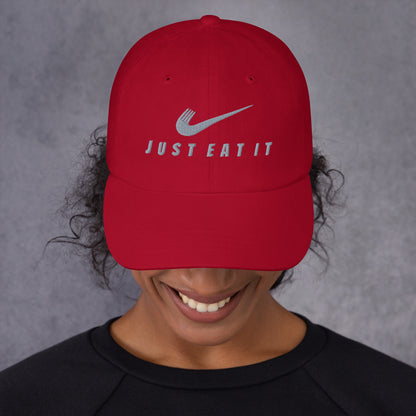 Red dad hat by Appetite Apparel featuring a Nike parody logo and classic design, front view with adjustable strap.